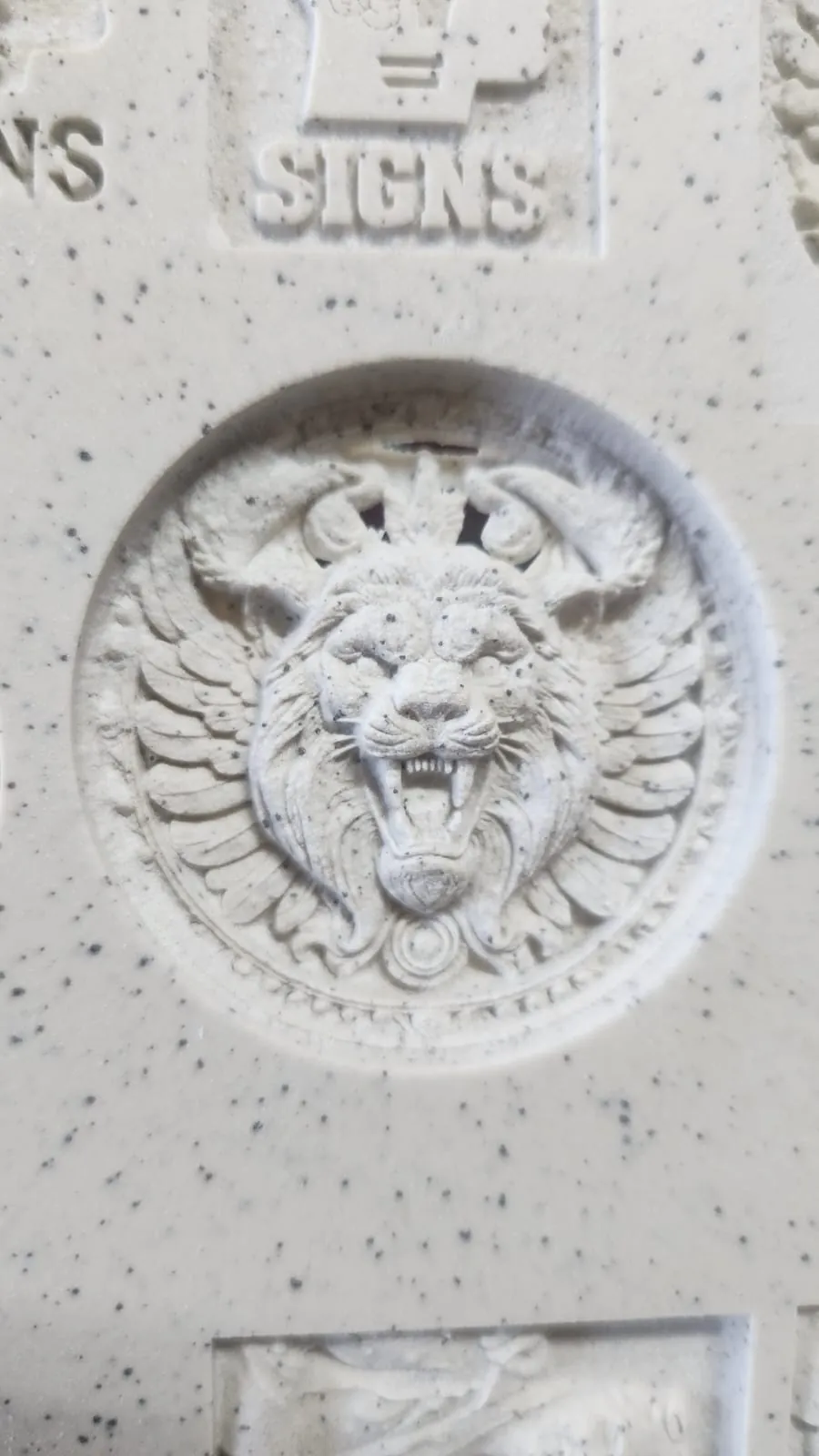 Detailed laser-engraved relief on stone