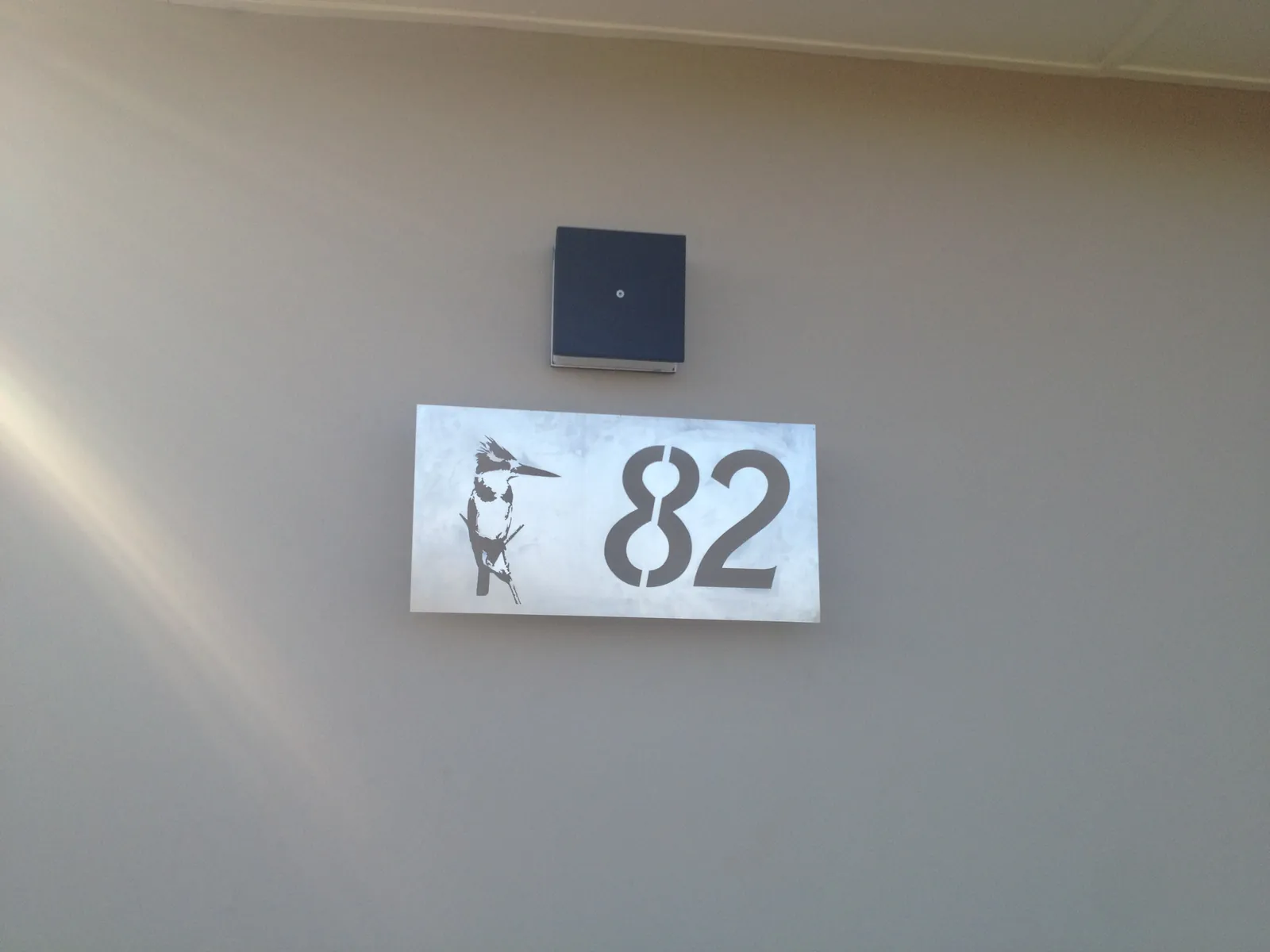 Custom black metal house number plate